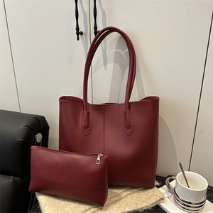 Burgundy faux leather tote bag and clutch set with vertical stitching for women
