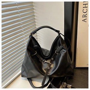 Black Hobo bag detail with matte PU leather texture and adjustable shoulder strap