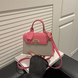 Elegant pink and beige contrast leather handbag with gold twist lock for women