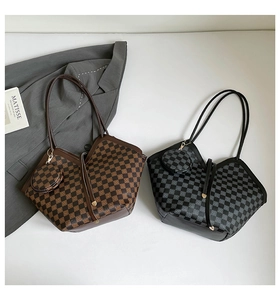 Flat lay of checkerboard tote bags with matching coin purses on a minimalist background