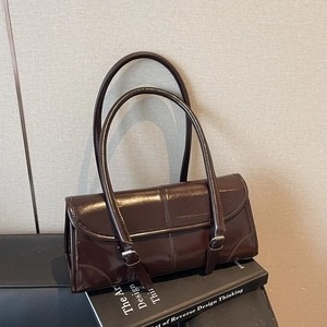 Retro dark brown patent leather baguette bag with dual straps and buckle details