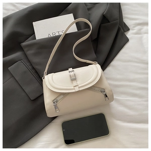 Top view of matte leather shoulder bag with arc flap and symmetric metal zippers