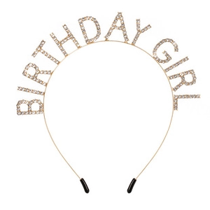 Detailed view of golden Birthday Girl headband with sparkling rhinestones and non-slip tips
