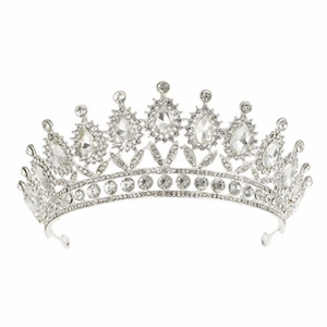 Detail of silver-plated tiara featuring teardrop crystals and symmetrical zircon patterns