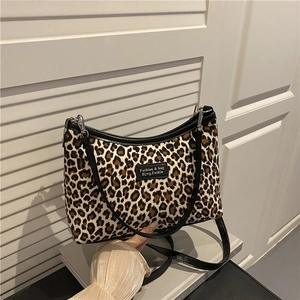 Stylish large capacity leopard print tote bag with black trim and brand patch detail