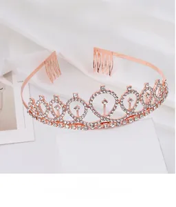 Detail of rose gold birthday crown with sparkling rhinestones and securing hair combs