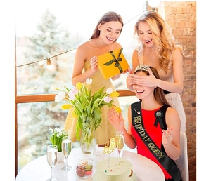 Black silk sash with Birthday Queen gold lettering and glittering rhinestone crown