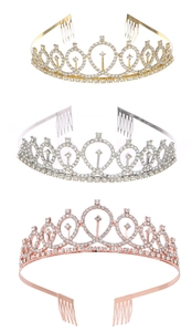 Close-up of sparkling rhinestone tiaras in gold, silver, and rose gold with metal side combs