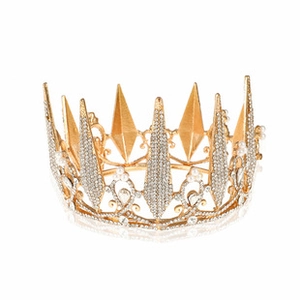 Close-up of golden Baroque wedding crown featuring white rhinestones and pearls details