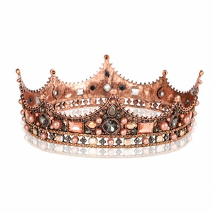 Detailed macro view of baroque silver tiara with red crystals and pearls for bridal wear