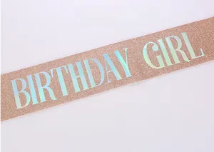 Close-up of rose gold birthday girl sash with sparkling glitter and iridescent lettering