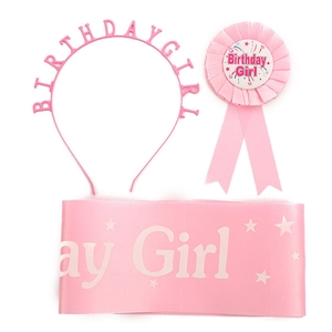 Detailed set of pink Birthday Girl accessories including headband, badge and satin sash