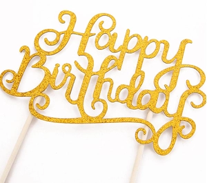 Close-up of golden glitter Happy Birthday cake topper with wooden sticks detail