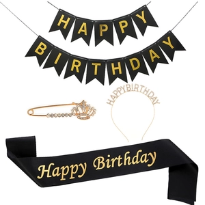 Detail of 4-piece black and gold birthday party set with sash, tiara, banner, and brooch