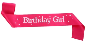 Detail of rose pink satin birthday girl sash with white glitter lettering and stars
