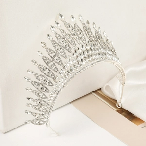 Detail of silver baroque crown with leaf patterns and sparkling crystals for weddings