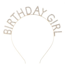 Detail of gold metal headband with rhinestone Birthday Girl lettering for party