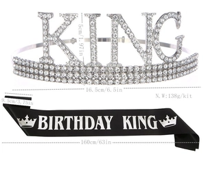 Close-up of silver rhinestone King crown and black Birthday King satin sash set