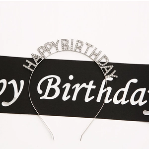 Detail of silver birthday headband featuring sparkling rhinestones and metal finish