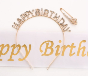Detail of gold rhinestone Happy Birthday headband, sash and crown brooch set