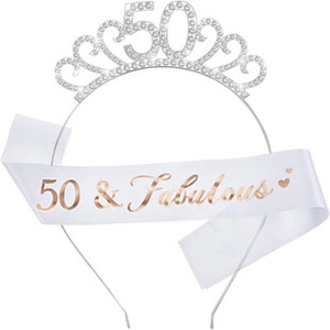 Detail of silver 50th birthday crown with rhinestones and 50 & Fabulous satin sash