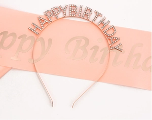 Detail of rose gold rhinestone Happy Birthday headband and pink satin party sash set