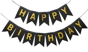 Detail of black Happy Birthday banner with gold foil lettering and white hanging string