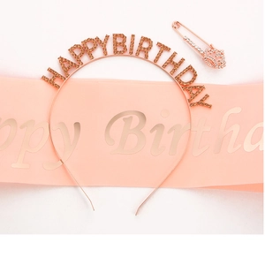 Detail of rose gold birthday set with rhinestone headband and pink satin sash