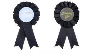 Detail of the Birthday Girl black pleated ribbon badge showing both front and back pin