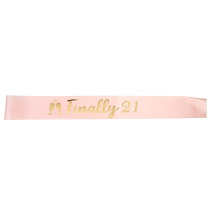 Pink satin birthday sash with gold foil 'Finally 21' text and champagne glass design
