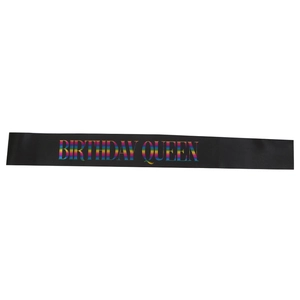 Black satin birthday queen sash with vibrant rainbow gradient text for party decor