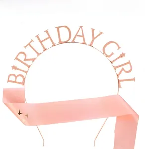 Close-up of rose gold Birthday Girl metal headband and pink satin sash party set