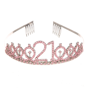 Detail of silver 21st birthday tiara featuring pink rhinestones and secure hair combs