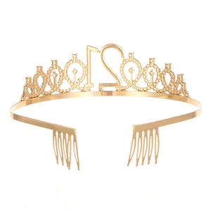 Detail of golden 21st birthday tiara with rhinestones and side hair combs for secure fit