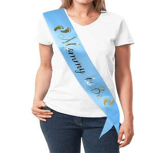 Detail of light blue Mommy to Be sash with gold foil lettering and footprint icons