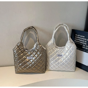 Quilted tote bags in metallic bronze and pearl white with diamond stitching details