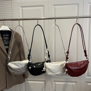Fashionable half-moon tote bag with knotted strap and pearl charm in four chic colors