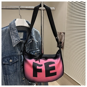 Detail of pink and black gradient crossbody bag with FE letter print and adjustable strap
