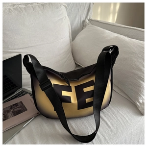 Detail of crescent crossbody bag with large FE letter print and black gold gradient finish