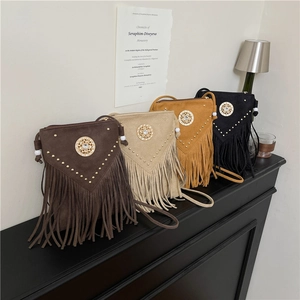 Vintage bohemian faux suede crossbody bag with fringe tassels and rivet stud detailing