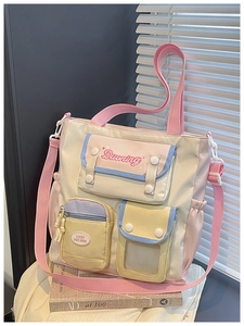Detail of multi-pocket tote bag with colorful contrast and functional storage compartments