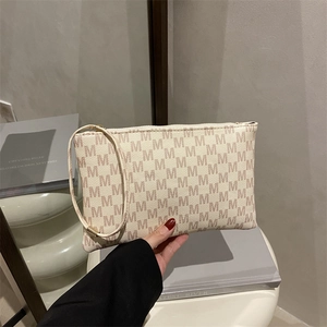 Elegant beige envelope handbag with M-pattern monogram and wristlet for women