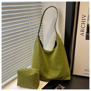 Close-up of olive green suede tote bag set with subtle leopard print and zipper pouch