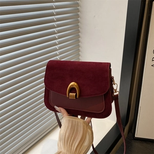 Chic burgundy crossbody bag in matte suede and smooth leather with gold U-buckle