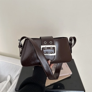 Chocolate brown faux leather underarm bag with oversized buckle and silver hardware strap