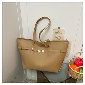 Detail of khaki leather tote bag with elegant belt buckle and large capacity