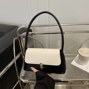 Minimalist black and white contrast leather shoulder bag with gold square buckle