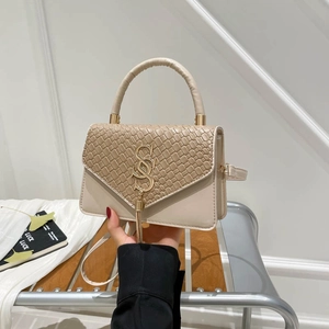 Chic beige crossbody bag with woven texture, gold SS logo and stylish metal tassel