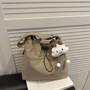 Minimalist large khaki nylon tote bag with cute cloud charm for daily commute