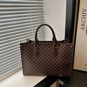 Brown vintage tote bag with M letter print and gold hardware for daily commuting